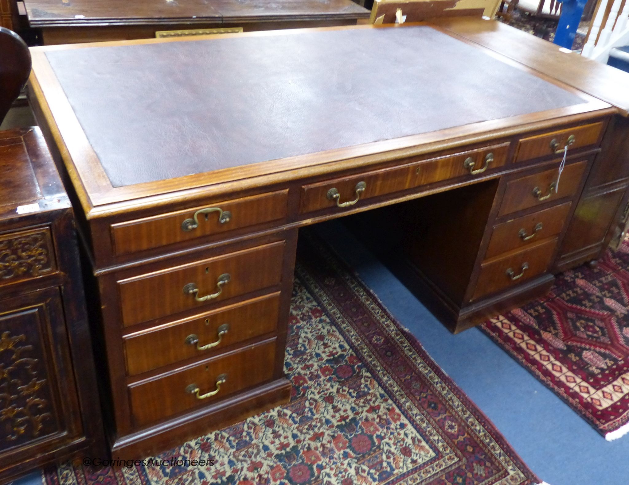 A George III style mahogany pedestal desk, length 152cm, depth 90cm, height 74cm